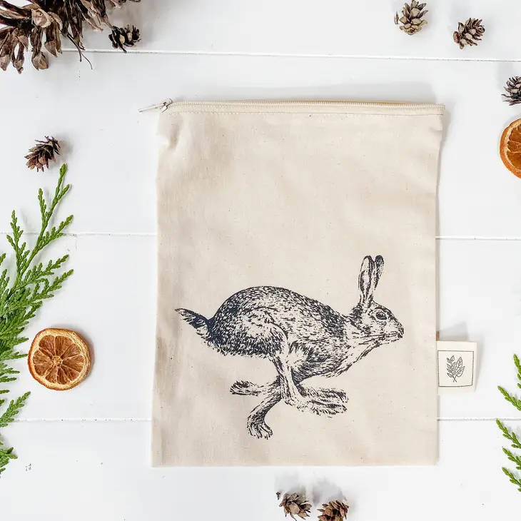 zippered bag with a black Hare print running full force that takes up half the bag
