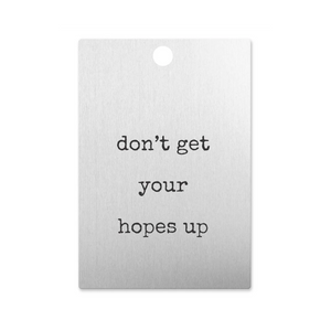 a silver tag that reads "Don't get your hopes up"