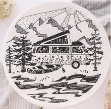 Load image into Gallery viewer,  Black ink print of a camper van with top raised trees and mountains, canoe and sunshine
