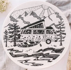  Black ink print of a camper van with top raised trees and mountains, canoe and sunshine