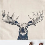 black ink front view moose face on a zippered bag