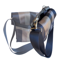 Load image into Gallery viewer, faded bag in the background and side view of a shoulder bag in the foreground
