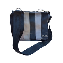 Load image into Gallery viewer, straight on front view of shoulder bag in dark and light colours with silver loops
