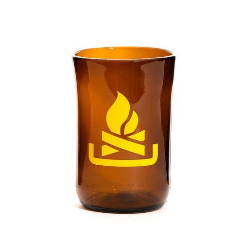 brown glass cup with yellow camp fire symbol on it