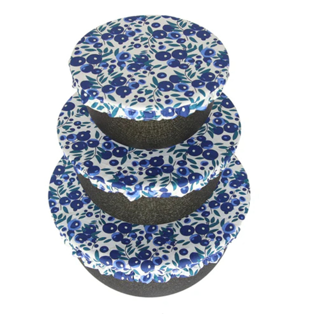 Set of three blueberry pattern bowl covers on a white background