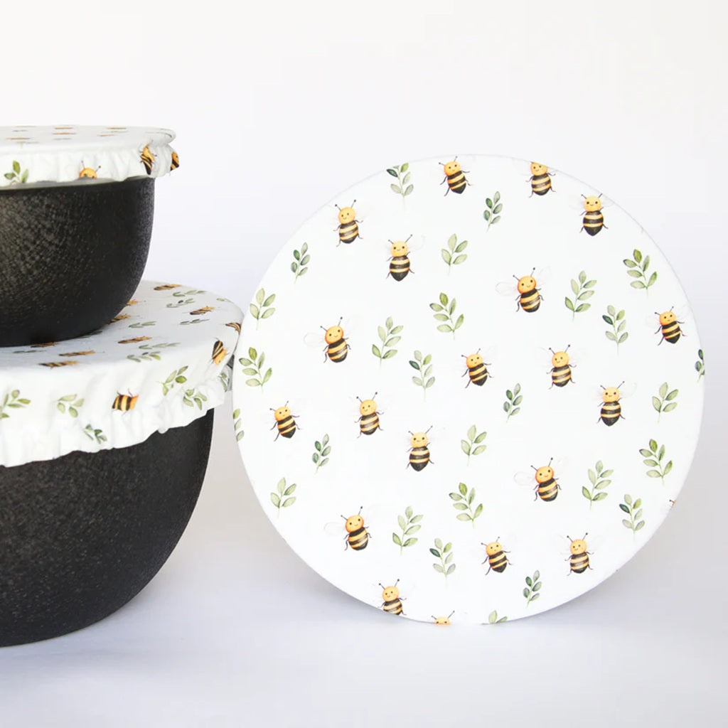Round bowl cover
 with bee pattern on a white background