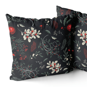 Two throw cushions main colour is black it has white, red and green foliage