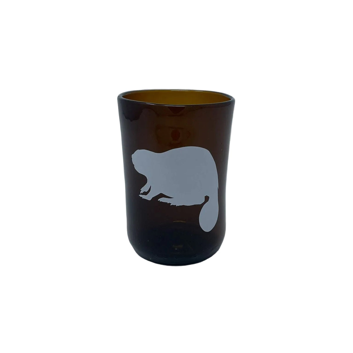 An amber brown recycled beer bottle glass tumbler with a white beaver silhouette printed on the front, set against a plain light gray background.