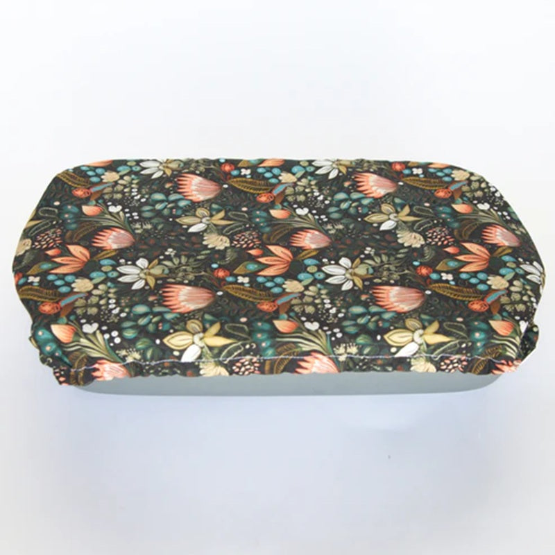 Floral-patterned casserole cover on a white background