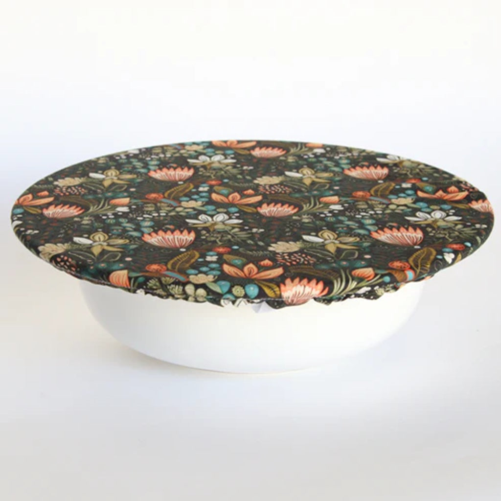 Round bowl cover with a floral patterned cover on a white background
