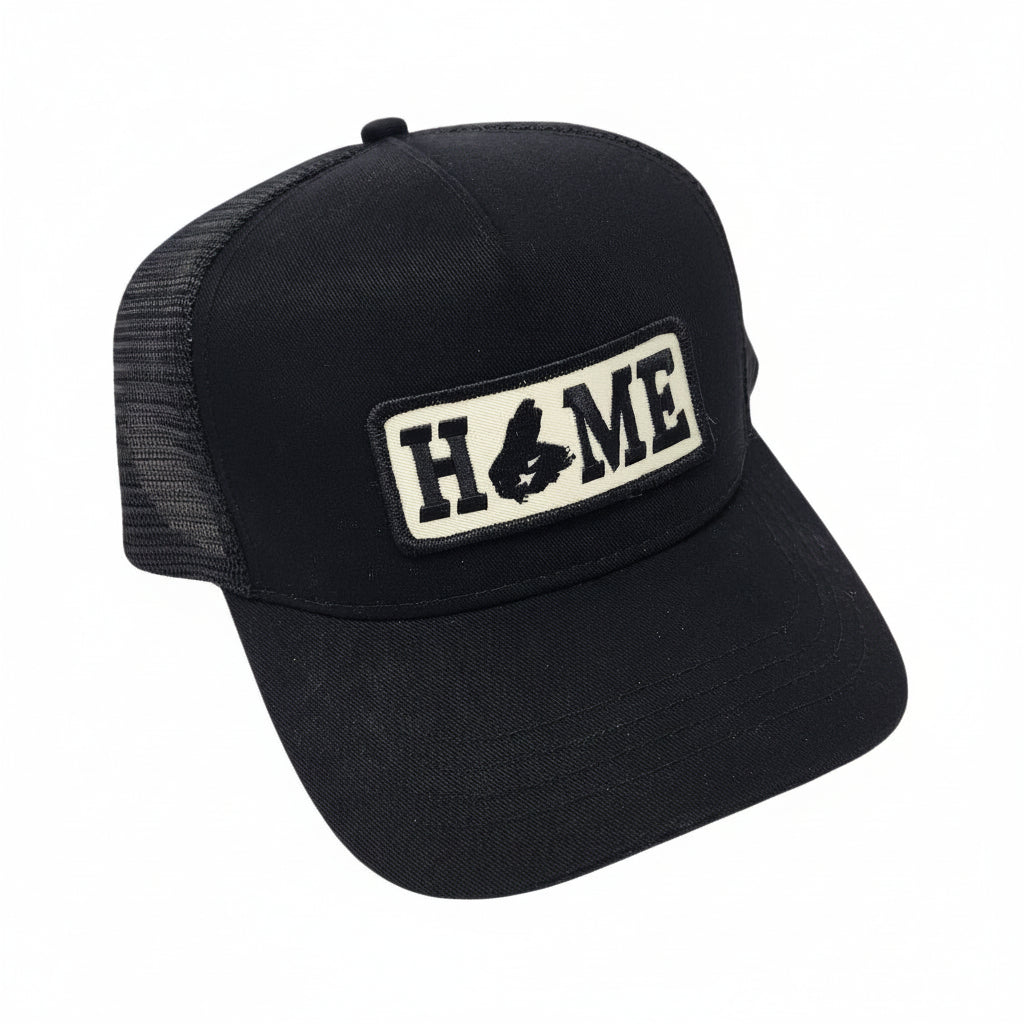 Black cap with Cape Breton 'HOME' patch on a white background