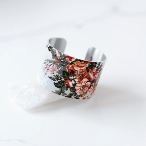 pinky, peachy, red flowers with green foliage printed on silver bracelet
