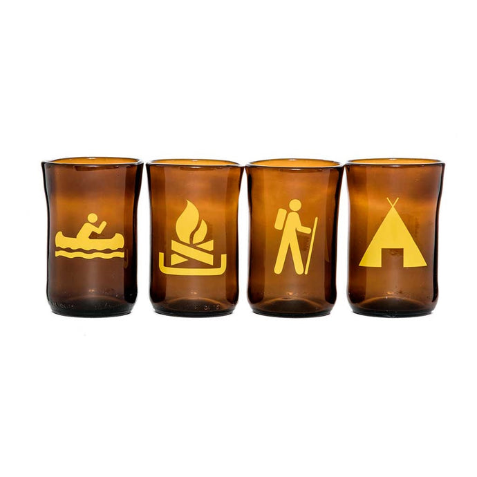 four tumblers with yellow pictograph of camping symbols