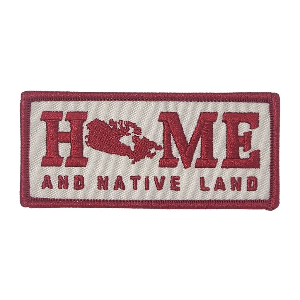 Embroidered patch with 'HOME AND NATIVE LAND' text on a white background
