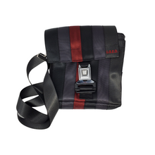 Load image into Gallery viewer, front view of bag made with different coloured seatbelts has a buckle closure
