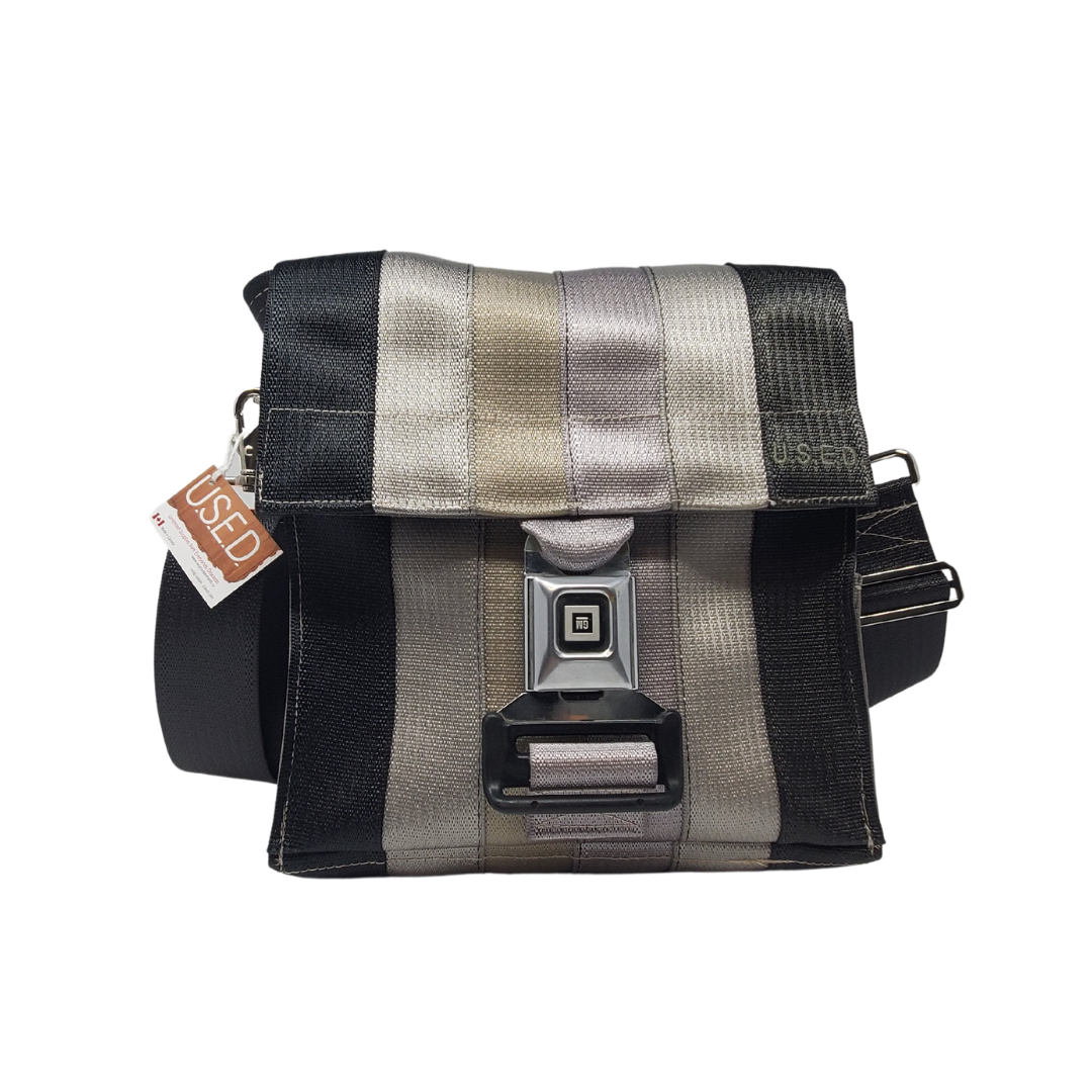 front view of bag made with different coloured seatbelts with buckle closure