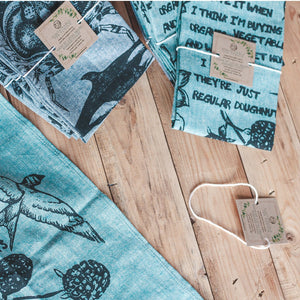 Tea Towels laying on a wood floor