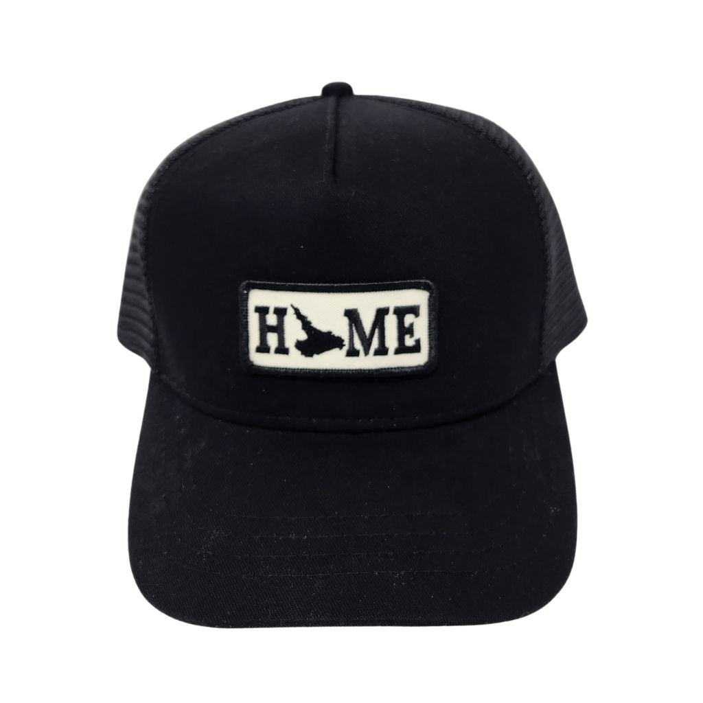 Black cap with Labrador 'HOME' patch on a white background