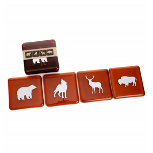 four glass coasters with animal prints on each in front of a stack of the same