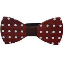 Load image into Gallery viewer, redish wood cut in a smooth bow tie shape with white polka dots and dark center

