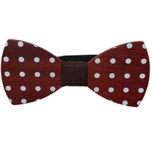redish wood cut in a smooth bow tie shape with white polka dots and dark center