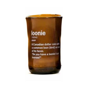 brown glass cup with loonie and it's definition printed on it in white
