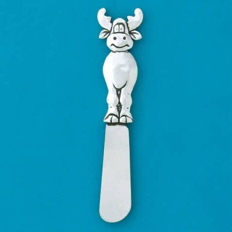 A silver-toned metal spreader or server featuring a sculpted moose head handle, set against a solid blue square background with a white border.