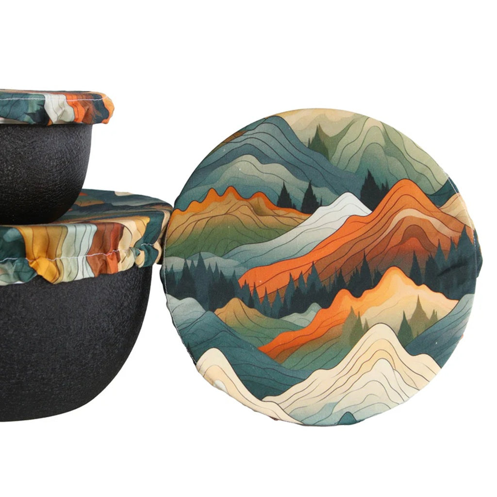 Round fabric bowl cover with mountain landscape design on a white background