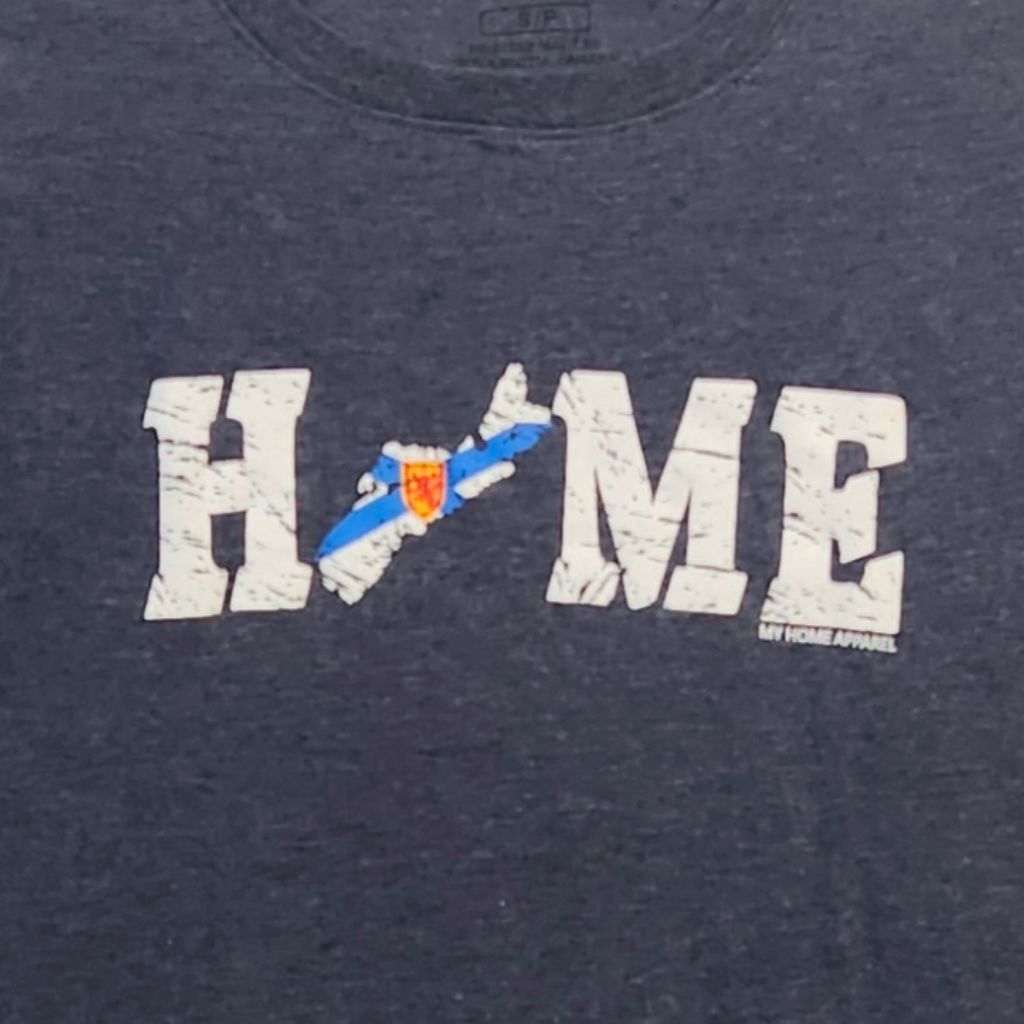 Navy blue t-shirt with Nova Scotia 'HOME' graphic design featuring a plane and shield emblem.