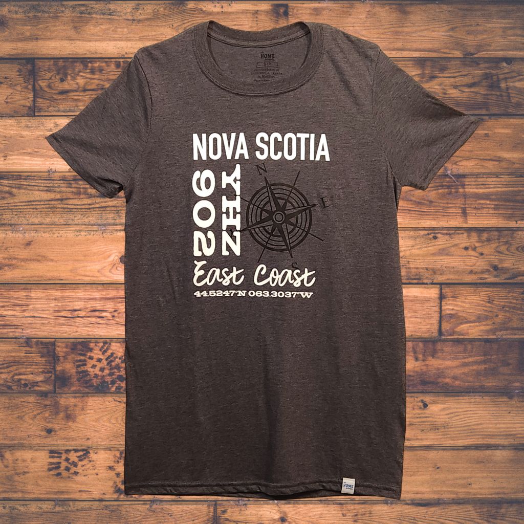 dark grey t-shirt with white text and graphics on a wooden surface