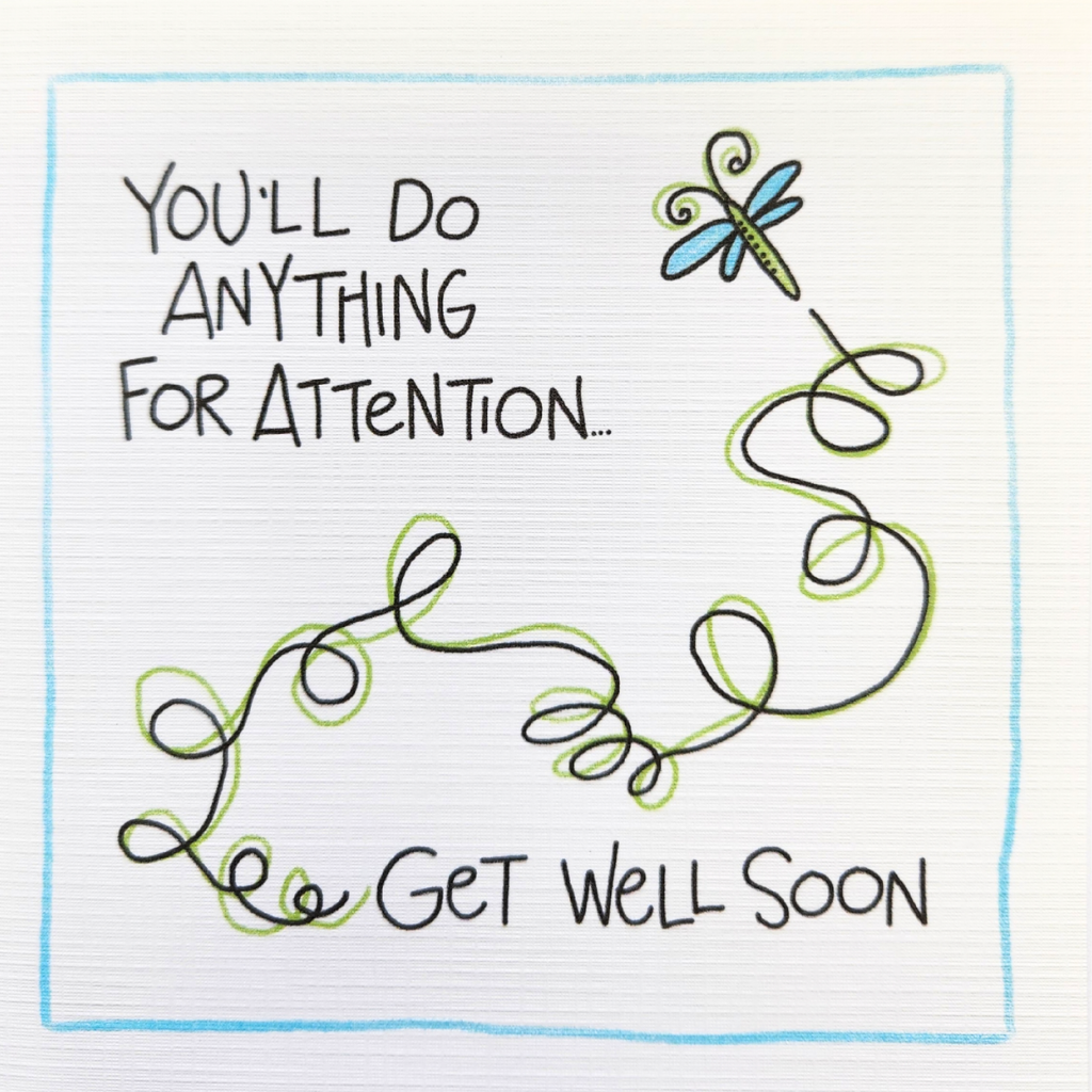 A square white card or print with lined paper texture, featuring a hand-drawn style design. The text reads 'YOU'LL DO ANYTHING FOR ATTENTION.