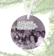 Load image into Gallery viewer, black &amp; white photo, 1950&#39;s, of a gathering of people sitting at a table for Christmas
