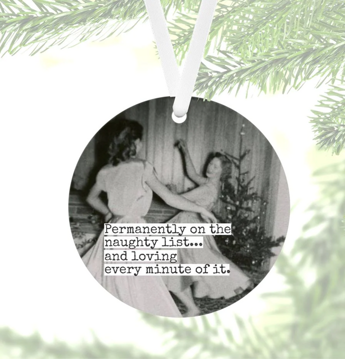 black and white photo, 1950's, two women dancing near a Christmas tree printed on round ornament