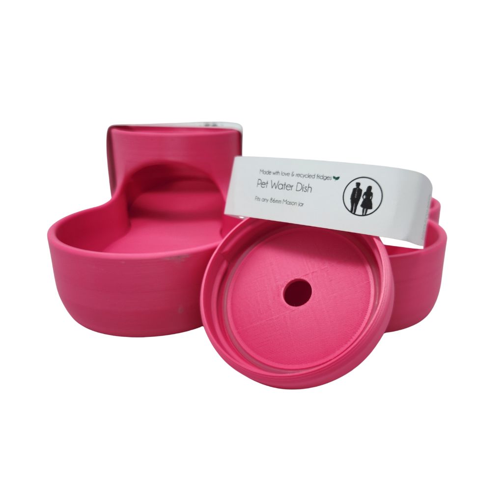 pink pet food dish with a white label on a white background
