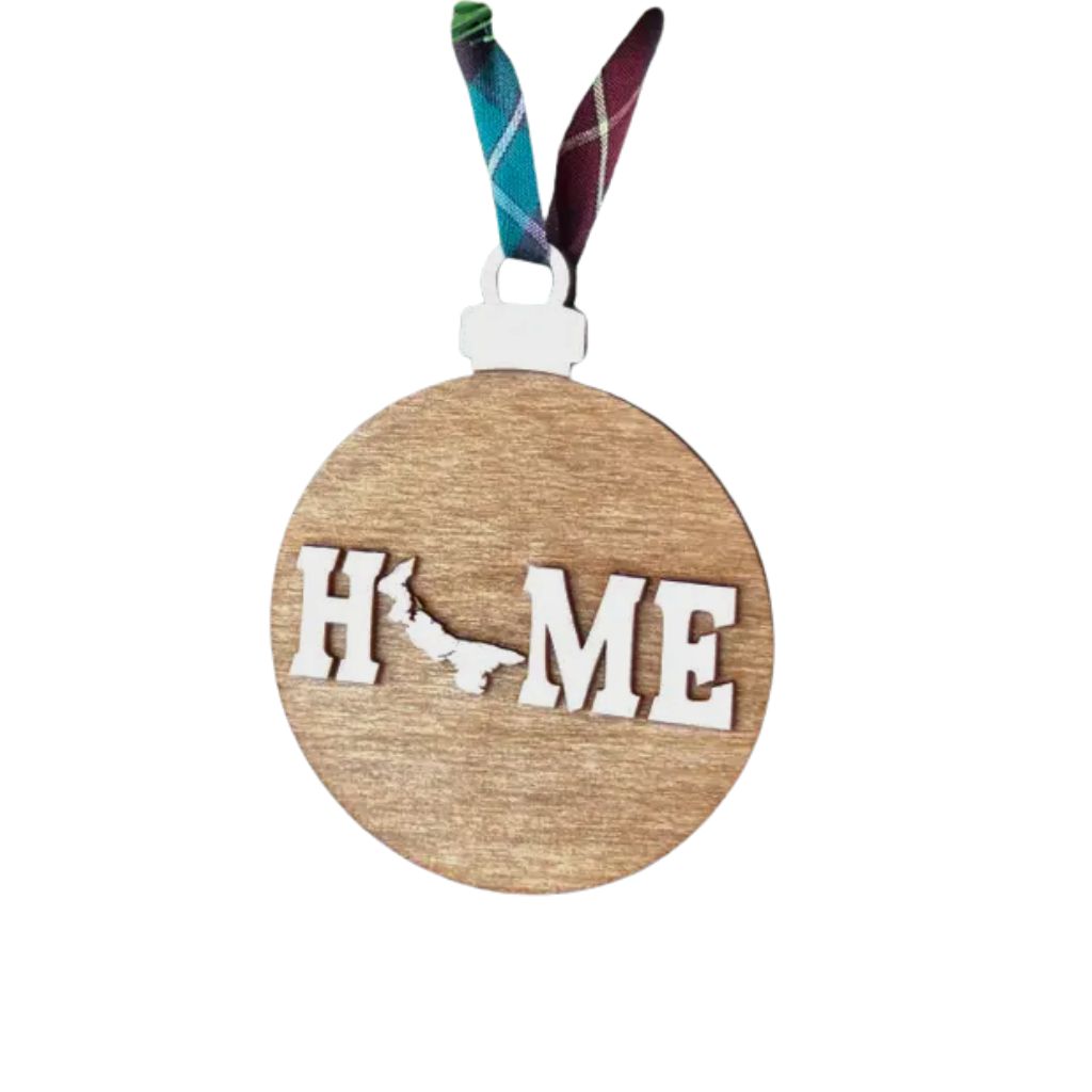 Wooden ornament with Prince Edward Island 'HOME' and map design on a white background