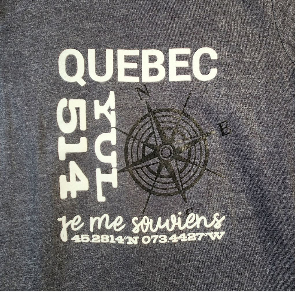 Gray t-shirt with 'Quebec 514' text and compass design on a dark background