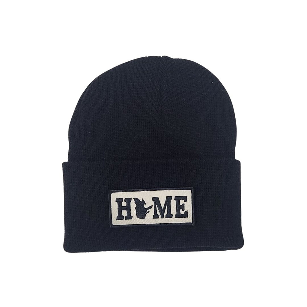 Black cuffed beanie with a Quebec 'HOME' patch