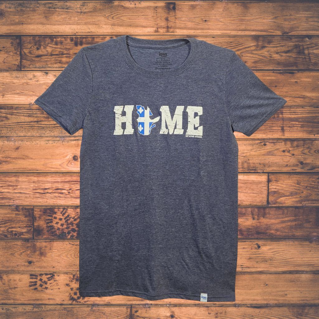 Navy t-shirt with Quebec 'HOME' text on a wooden surface