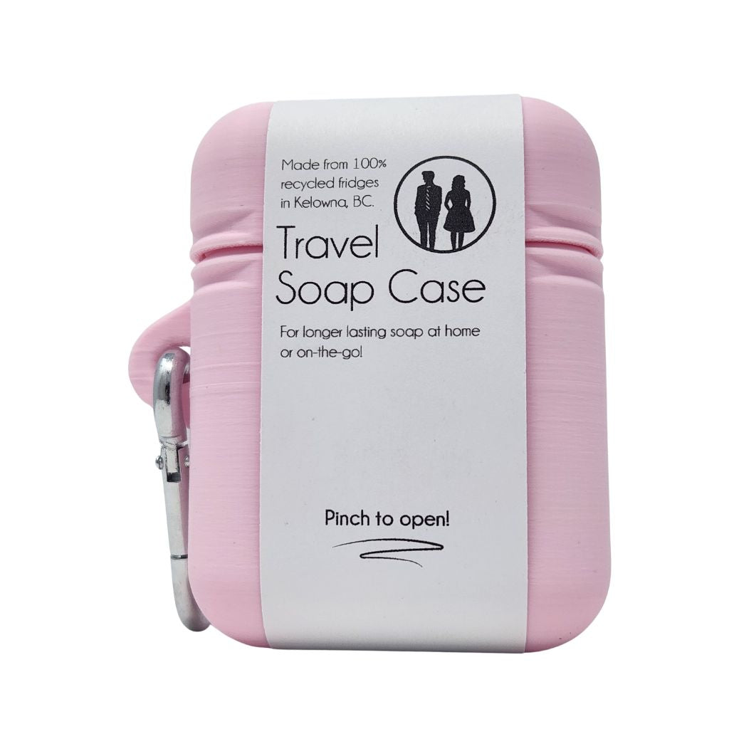 Pink travel soap case with a white label on a white background