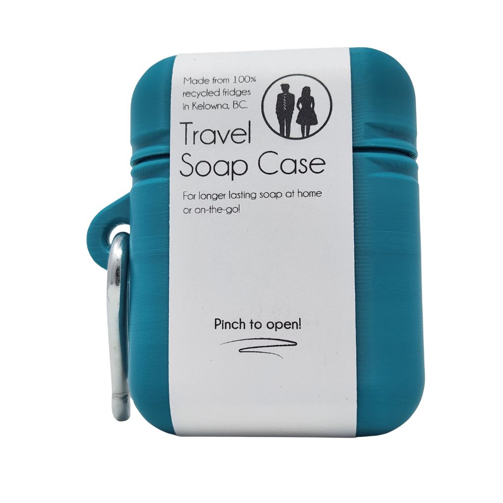 Blue travel soap case with a white label on a white background