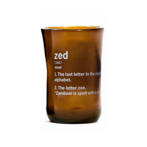 brown glass cup with zed and it's definition printed in white