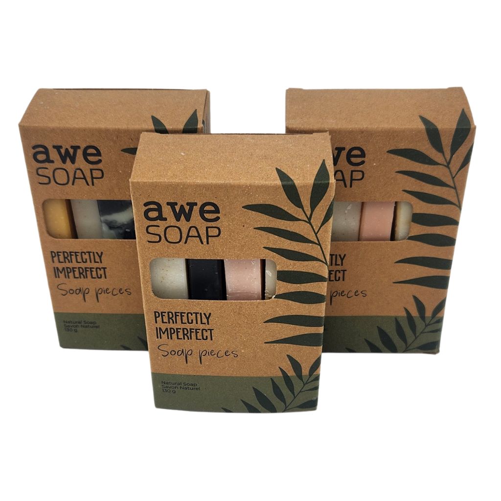 3 brown boxes on white background with soap pieces