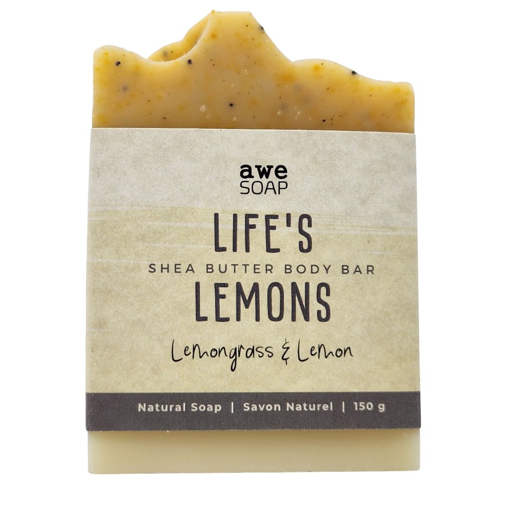 close up of handmade bar of soap with paper sleeve