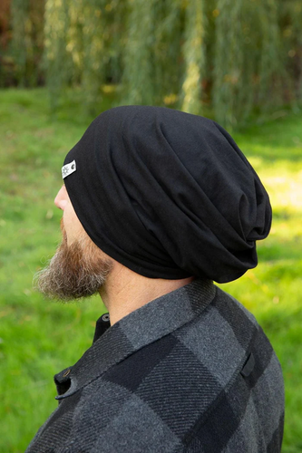 Man with beard wearing an Adult 5 Way Beanie outside