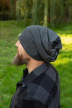 Man with beard wearing an Adult 5 Way Beanie outside