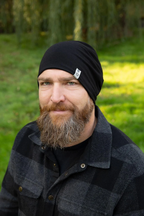 Man with beard wearing an Adult 5 Way Beanie outside