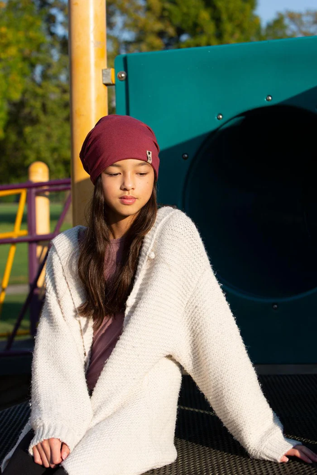 Girl wearing an Adult 5 Way Beanie outside