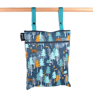 Double Duty Wet Bag hanging from straps with front and top zippers