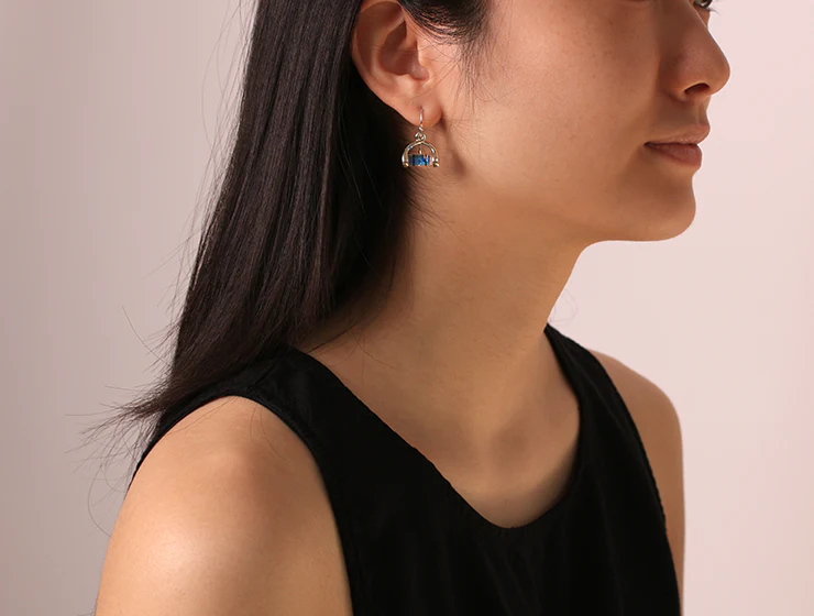 person with dark hair side view of head showing Twist Level Earrings