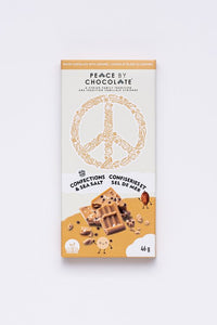 golden chocolate bar in a gold and white wrapper with a peace symbol on it